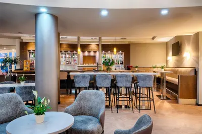 Ein Sitzbereich in der Unterkunft Welcome Hotel Wesel