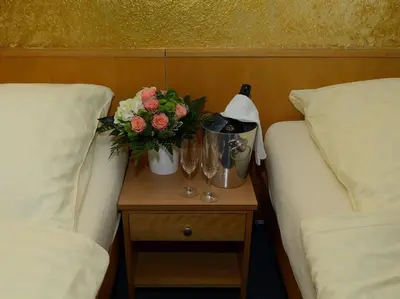 Ein Bett oder Betten in einem Zimmer der Unterkunft Hotel Alberga