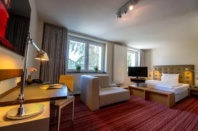 Ein Bett oder Betten in einem Zimmer der Unterkunft Hotel An der Gruga