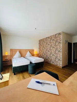Ein Bett oder Betten in einem Zimmer der Unterkunft Hotel Sittardsberg