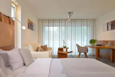 Ein Bett oder Betten in einem Zimmer der Unterkunft Parkhotel Oberhausen