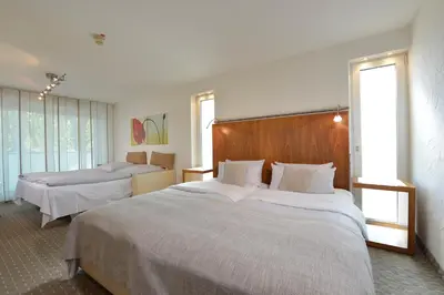 Ein Bett oder Betten in einem Zimmer der Unterkunft Parkhotel Oberhausen