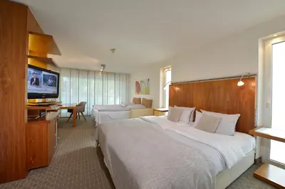 Ein Bett oder Betten in einem Zimmer der Unterkunft Parkhotel Oberhausen