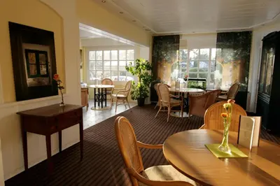 Ein Sitzbereich in der Unterkunft Hotel Villa Verde