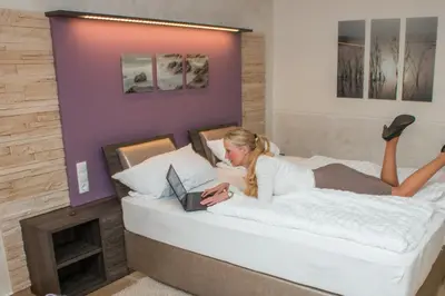 Ein Bett oder Betten in einem Zimmer der Unterkunft Landhotel Zum Hasen Hein