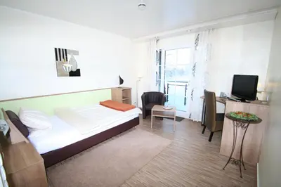 Ein Bett oder Betten in einem Zimmer der Unterkunft Landhotel Zum Hasen Hein