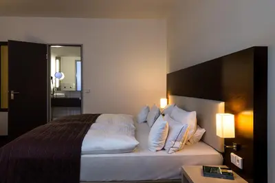 Ein Bett oder Betten in einem Zimmer der Unterkunft Hotel Esplanade Dortmund