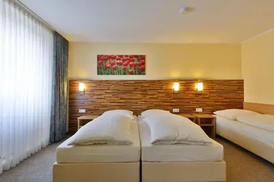 Ein Bett oder Betten in einem Zimmer der Unterkunft City Partner Central-Hotel Wuppertal