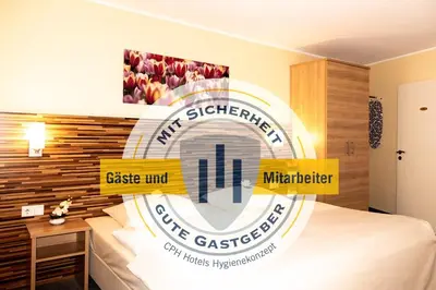 Ein Bett oder Betten in einem Zimmer der Unterkunft City Partner Central-Hotel Wuppertal