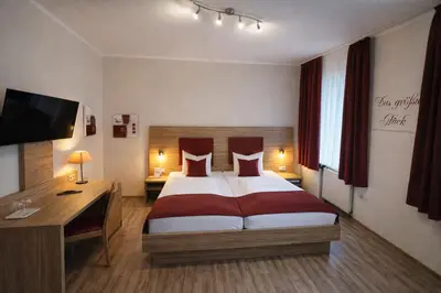 Ein Bett oder Betten in einem Zimmer der Unterkunft Arena Hotel
