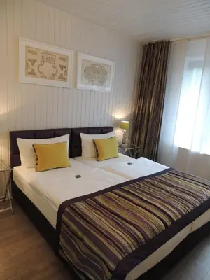Ein Bett oder Betten in einem Zimmer der Unterkunft Hotel Prinz Anton