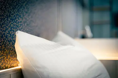 Ein Bett oder Betten in einem Zimmer der Unterkunft Gartenhotel Fettehenne