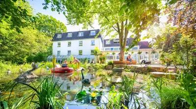 Ein Garten an der Unterkunft Gartenhotel Fettehenne