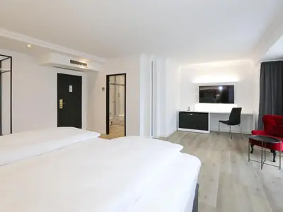 Ein Bett oder Betten in einem Zimmer der Unterkunft DORMERO Hotel Meerbusch