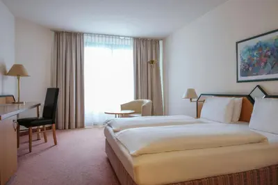 Ein Bett oder Betten in einem Zimmer der Unterkunft FOUR Essen City Centre