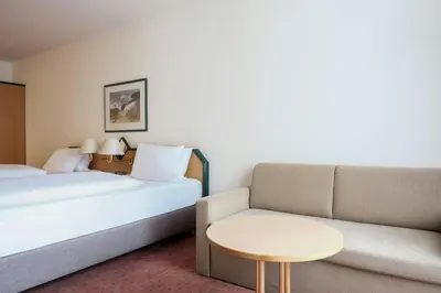 Ein Bett oder Betten in einem Zimmer der Unterkunft FOUR Essen City Centre