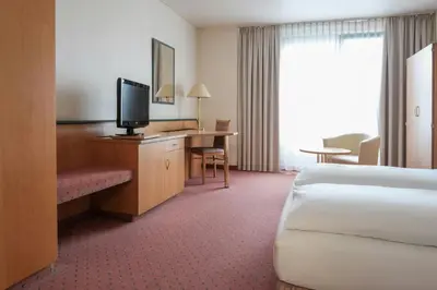 Ein Bett oder Betten in einem Zimmer der Unterkunft FOUR Essen City Centre