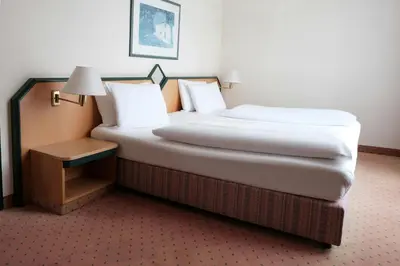 Ein Bett oder Betten in einem Zimmer der Unterkunft FOUR Essen City Centre