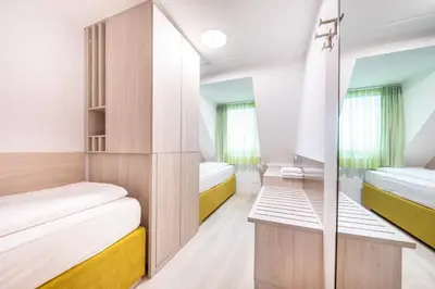 Ein Bett oder Betten in einem Zimmer der Unterkunft HOTEL Am Spichernplatz