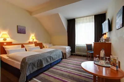 Ein Bett oder Betten in einem Zimmer der Unterkunft Sure Hotel by Best Western Ambassador Duesseldorf