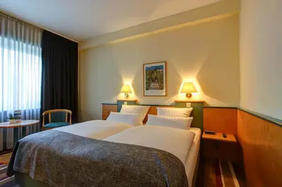 Ein Bett oder Betten in einem Zimmer der Unterkunft Sure Hotel by Best Western Ambassador Duesseldorf