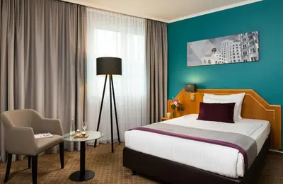 Ein Bett oder Betten in einem Zimmer der Unterkunft Leonardo Hotel Düsseldorf City Center