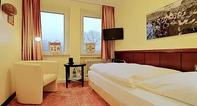 Ein Bett oder Betten in einem Zimmer der Unterkunft Retro - Art - Hotel Lünen