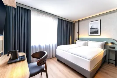 Ein Bett oder Betten in einem Zimmer der Unterkunft Radisson Hotel Dusseldorf City Center
