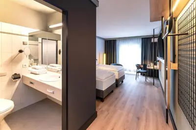 Ein Bett oder Betten in einem Zimmer der Unterkunft Radisson Hotel Dusseldorf City Center
