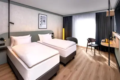 Ein Bett oder Betten in einem Zimmer der Unterkunft Radisson Hotel Dusseldorf City Center