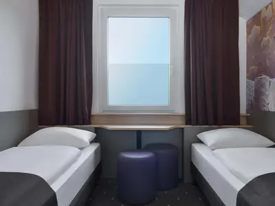 Ein Bett oder Betten in einem Zimmer der Unterkunft B&B Hotel Düsseldorf-Ratingen