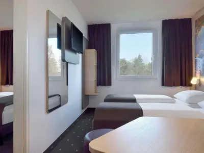 Ein Bett oder Betten in einem Zimmer der Unterkunft B&B Hotel Düsseldorf-Ratingen