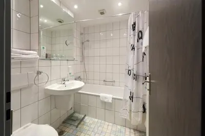 Ein Badezimmer in der Unterkunft Hotel Schumacher Düsseldorf