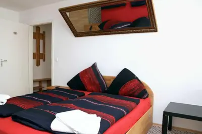 Ein Bett oder Betten in einem Zimmer der Unterkunft Aparthotel Kompass A 102-103
