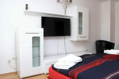 Ein Bett oder Betten in einem Zimmer der Unterkunft Aparthotel Kompass A 102-103