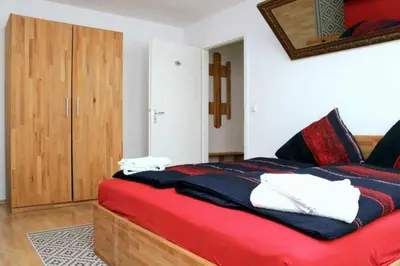 Ein Bett oder Betten in einem Zimmer der Unterkunft Aparthotel Kompass A 102-103