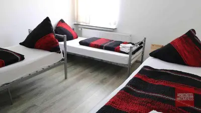 Ein Bett oder Betten in einem Zimmer der Unterkunft Aparthotel Kompass A 201