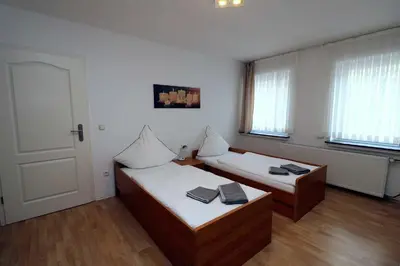 Ein Bett oder Betten in einem Zimmer der Unterkunft Aparthotel Kompass A 202-203
