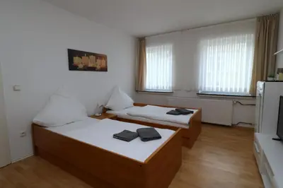Ein Bett oder Betten in einem Zimmer der Unterkunft Aparthotel Kompass A 202-203