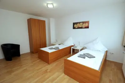 Ein Bett oder Betten in einem Zimmer der Unterkunft Aparthotel Kompass A 202-203