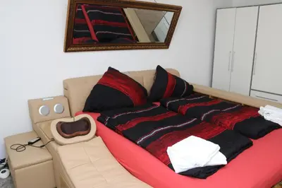 Ein Bett oder Betten in einem Zimmer der Unterkunft Aparthotel Kompass A 301