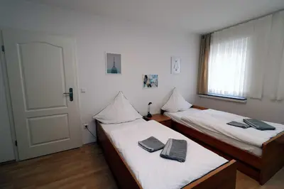 Ein Bett oder Betten in einem Zimmer der Unterkunft Aparthotel Kompass A 302-303