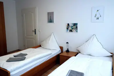 Ein Bett oder Betten in einem Zimmer der Unterkunft Aparthotel Kompass A 302-303