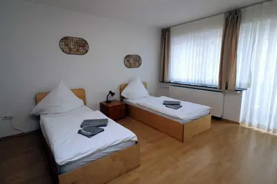 Ein Bett oder Betten in einem Zimmer der Unterkunft Aparthotel Kompass A 302-303