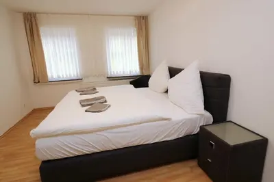 Ein Bett oder Betten in einem Zimmer der Unterkunft Aparthotel Kompass A 304