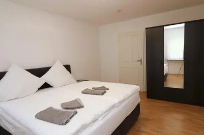 Ein Bett oder Betten in einem Zimmer der Unterkunft Aparthotel Kompass A 304