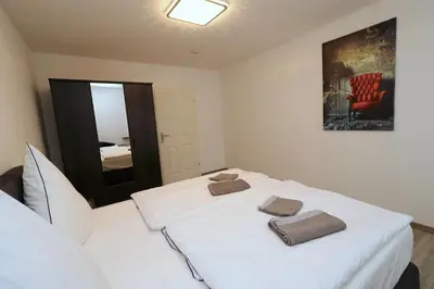 Ein Bett oder Betten in einem Zimmer der Unterkunft Aparthotel Kompass A 401