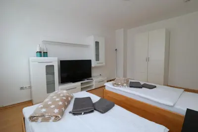 Ein Bett oder Betten in einem Zimmer der Unterkunft Aparthotel Kompass A 402-403