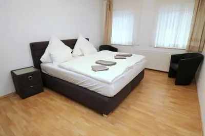 Ein Bett oder Betten in einem Zimmer der Unterkunft Aparthotel Kompass A 404