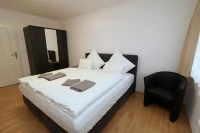 Ein Bett oder Betten in einem Zimmer der Unterkunft Aparthotel Kompass A 404